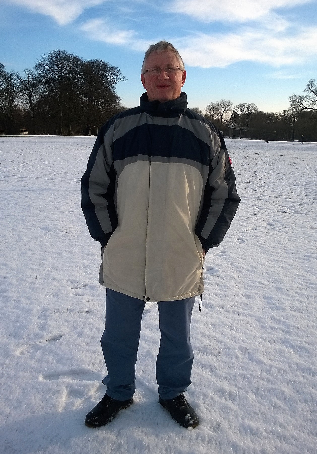 An image of Brian Marshall standing in a snowy field